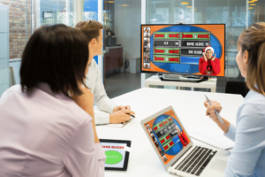 Coworkers sitting in front of a screen